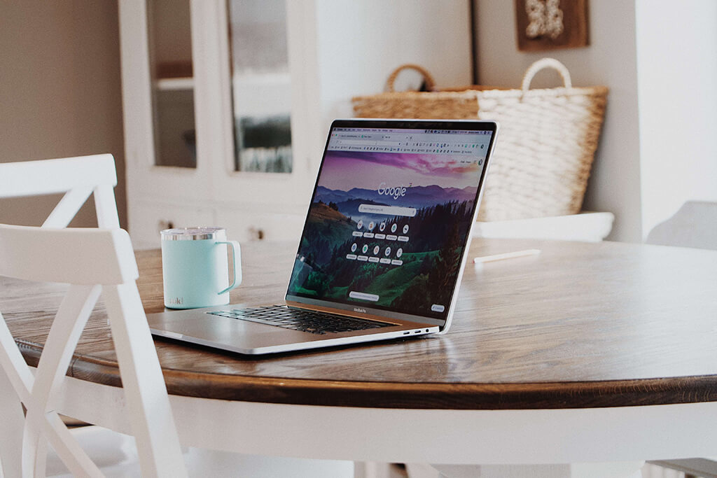 macbook-on-brown-wooden-table-4200831